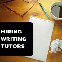 On a wooden table, there is a blank lined notebook, a pen, two crumpled up balls of paper, a black coffee, and a pair of glasses. On the left side, there is a black panel with white text that says "Hiring Writing Tutors." 