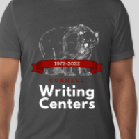 A screenshot of the 50th CWC T-shirt that is available to order. It is a dark gray t-shirt that has a white bear on it, with a red banner that says &quot;1972-2022&quot;. Under the banner, it says &quot;The Cornell Writing Centers.&quot; has 