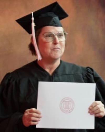 picture of student holding a diploma