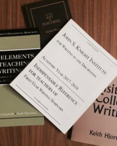 Teacher training books scattered on a table